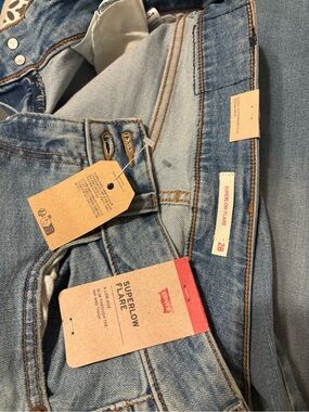 Levi's Light Wash Denim Jeans with Red Leather Patch